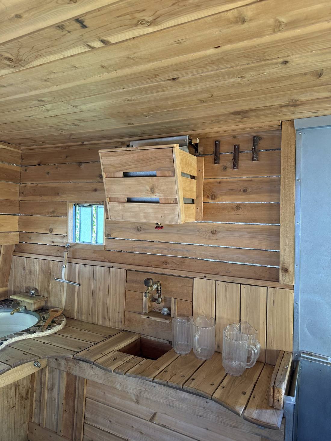 The cold plunge tub built into the bench inside The Cousin Eddie