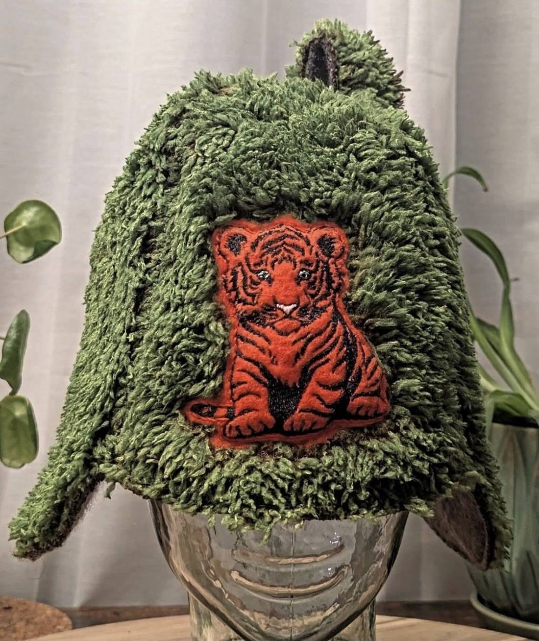 Green shag wool sauna hat with an embroidered tiger